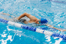 swimmer in a pool swimming in a lane