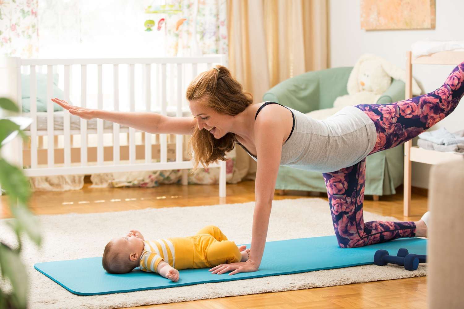 woman doing pilates with baby